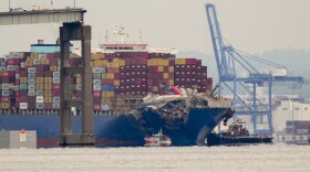 Tugboats escort the cargo ship Dali after it was refloated in Baltimore, Monday, May 20, 2024. The vessel struck the Francis Scott Key Bridge on March 26 causing it to collapse and resulting in the death of six people. (AP Photo/Matt Rourke)