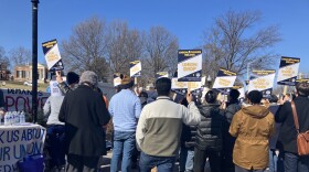 Union members paraded in front of Hopkins’ Homewood Campus to call for fair wages and termination policies. Photo by Bri Hatch/WYPR.