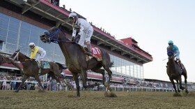 Junior Alvarado atop Skippylongstocking, left, John Velezques atop Simplification, center, and Irad Ortiz Jr. atop Armagnac participate during the 147th running of the Preakness Stakes horse race at Pimlico Race Course, Saturday, May 21, 2022, in Baltimore. (AP Photo/Julio Cortez)