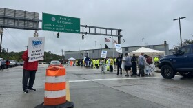 Workers with the International Longshoremen’s Association, ILA 333 and 1429 picket at the entrances of the Dundalk Marine Terminal. Photo by Wambui Kamau/WYPR.