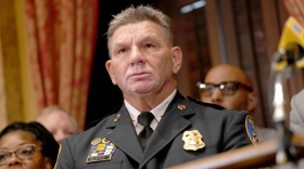 Richard Worley, deputy commissioner at Baltimore Police Department, with Mayor Brandon Scott at a press conference. (Kaitlin Newman/The Baltimore Banner)