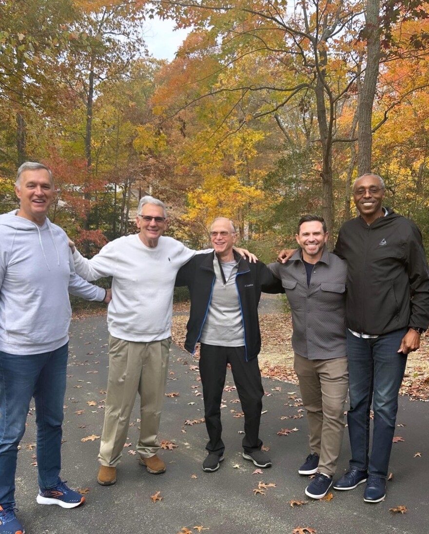 Jim Hursey, Mike Razzi, and Dennis Myers (L to R) met at a support group for people diagnosed with young-onset dementia. Richie Frieman (second from R) wrote about their friendship and how their message has inspired people living with young-onset dementia, including Glenn Smith (far R). Frieman's book is titled, "The Optimistics." Credit: Courtesy of Richie Frieman