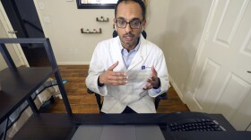 Medical director of Doctor on Demand Dr. Vibin Roy speaks to a patient during an online primary care visit from his home in Texas. Federal health experts now suggest that adults should be screened for anxiety.