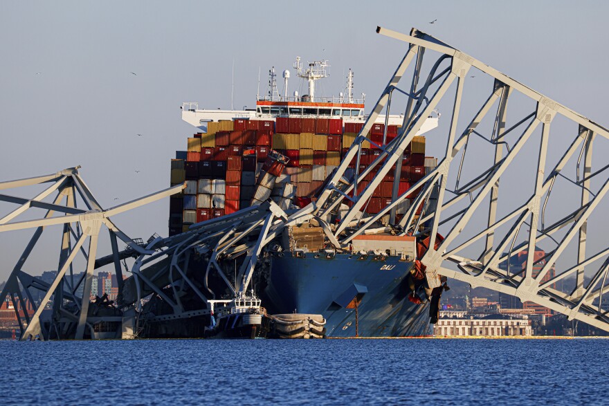 Wreckage of the Francis Scott Key Bridge rests on the container ship Dali, Saturday, March 30, 2024, in Baltimore, Md. (AP Photo/Julia Nikhinson)