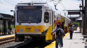 A man runs to catch the Light Rail heading toward BWI Airport at Camden Station in Baltimore on Aug. 11, 2022.