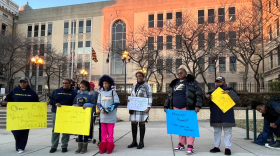 Charm City Virtual parents and students rallied outside the Baltimore City Public School Building on North Avenue on Jan. 11, 2023, to protest the proposed elimination of the program for elementary students. (Liz Bowie/The Baltimore Banner)