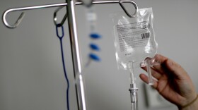 FILE- In this Feb. 9, 2018, file photo, a nurse hooks up an IV to a flu patient at Upson Regional Medical Center in Thomaston, Ga. Researchers found in a study of credit reports that more than 2 percent of adults had medical bills under $200 sent to a collections agency. More than half of the annual medical collections were for less than $600, according to the study, which examined 2016 credit reports for more than 4 million unidentified people. (AP Photo/David Goldman, File)