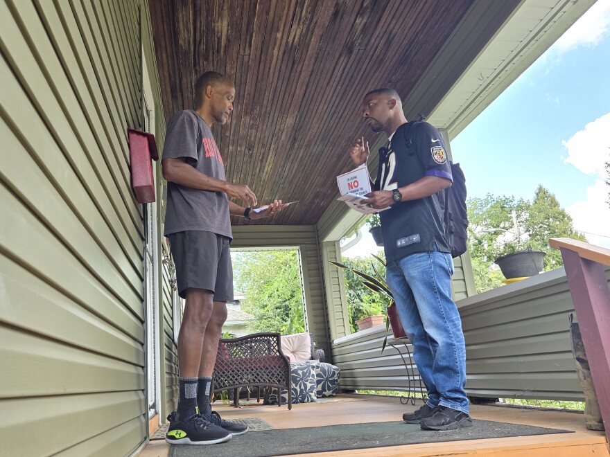 Courtney Jenkins meets Tracy Smith on the porch of Smith's home. Jenkins is part of "Stop Sinclair", the group aiming to stop Question H.