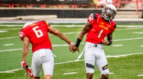  Two Maryland football players.