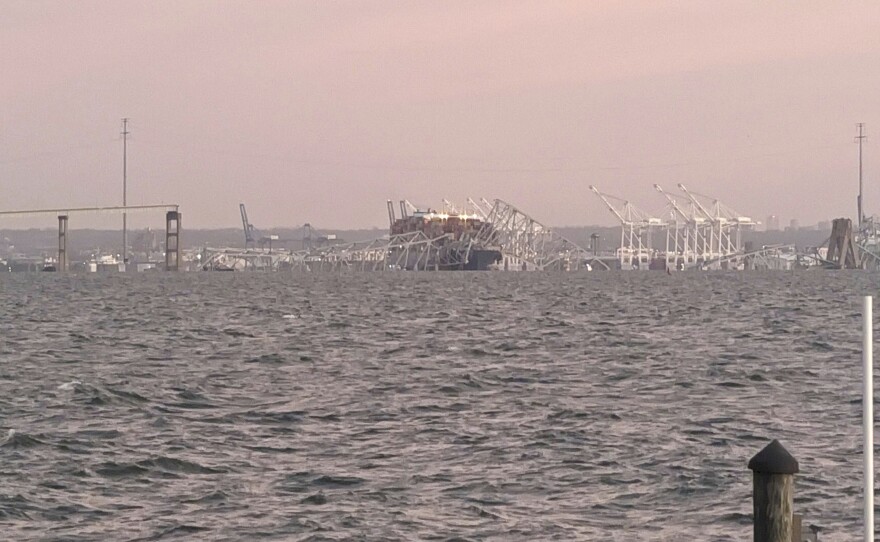 Baltimore's Francis Scott Key Bridge collapse is seen early Tuesday morning from Riviera Beach, Md., hours after a container ship rammed into the bridge. (AP Photo/Nathan Ellgren)