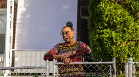 Betty Fenner-Davis, a successful fashion and costume designer, in front of her home in Baltimore's Allendale neighborhood. (photo credit Baltimore Banner)