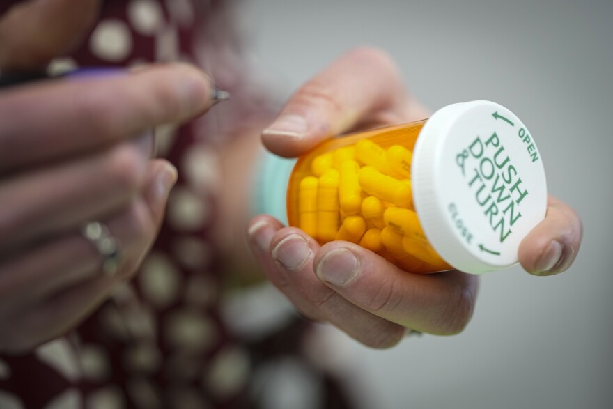 Jessi Stout, owner of the Table Rock Pharmacy fills a prescription on Friday, Jan. 6, 2023, in Morganton, N.C. Drugstore chains are still trying to find enough employees to put a stop to temporary pharmacy closures. (AP Photo/Chris Carlson)