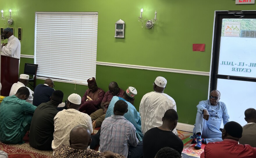 During Friday prayers, congregants who originally hail from Senegal and Sierra Leone, listen as the Chair of the Governor’s Commission on African Affairs encourages those who are eligible to vote to do so.