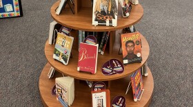 The Baltimore County Public Library's Towson branch has a display of books that have been challenged or banned in the U.S. Photo by John Lee/WYPR.