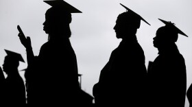 New graduates line up before the start of a community college commencement in East Rutherford, N.J., on May 17, 2018.