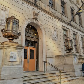 Come here often? The entrance for jury service at Courthouse East, 111 N Calvert Street. (photo credit Aaron Henkin / WYPR)