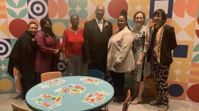 Baltimore City Schools’ Food and Nutrition Services team with exhibit curator Beth Maloney (second to the right)