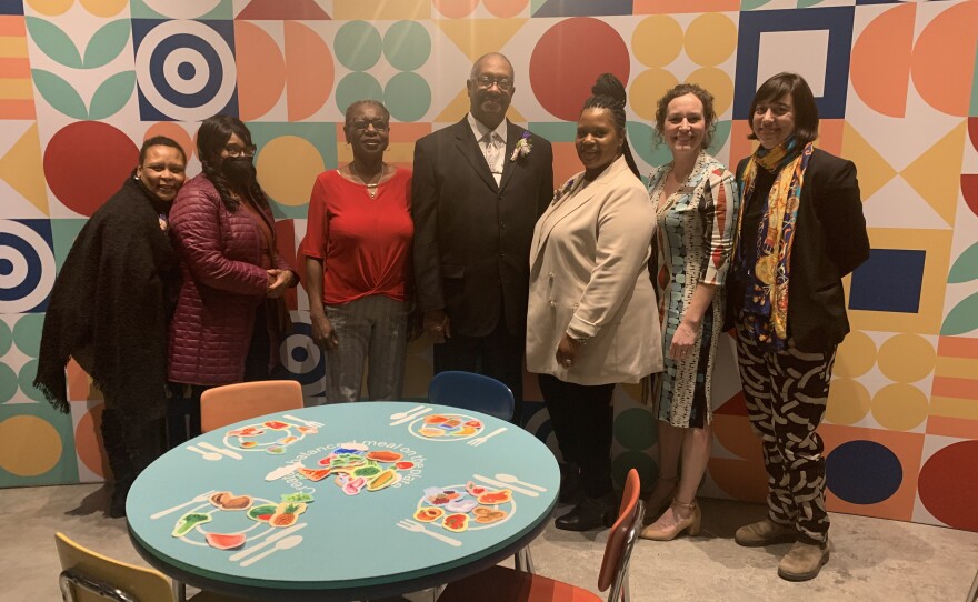 Baltimore City Schools’ Food and Nutrition Services team with exhibit curator Beth Maloney (second to the right)