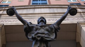  Statue of Blind Justice on the front of the Albert V. Bryan United States Courthouse in Alexandria, Virginia. 