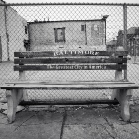 This slogan was painted on benches all over the city more than 20 years ago. Who's idea was that? (Photo credit Krishna Sharma, The Baltimore Banner)