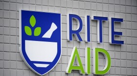 FILE - A Rite Aid sign is displayed on the facade of a store in Pittsburgh, Monday, Jan. 23, 2023. Rite Aid plans to plans to close about 7% of its stores initially, as the drugstore chain makes its way through its Chapter 11 bankruptcy process. (AP Photo/Gene J. Puskar)