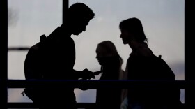 In this Nov. 14, 2019, photo, students walk on the campus of Utah Valley University in Orem, Utah. More college students are turning to their schools for help with anxiety, depression and other mental health problems. That's according to an Associated Press review of more than three dozen public universities. (AP Photo/Rick Bowmer)