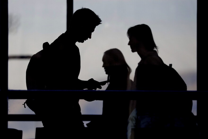 In this Nov. 14, 2019, photo, students walk on the campus of Utah Valley University in Orem, Utah. More college students are turning to their schools for help with anxiety, depression and other mental health problems. That's according to an Associated Press review of more than three dozen public universities. (AP Photo/Rick Bowmer)