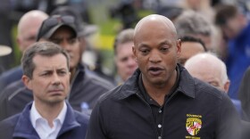 Maryland Gov. Wes Moore, accompanied by Transportation Secretary Pete Buttigieg and other officials speaks during a news conference near the scene where a container ship collided with a support on the Francis Scott Key Bridge, in Dundalk, Md., Tuesday, March 26, 2024. (AP Photo/Matt Rourke)