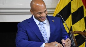 Maryland Gov. Wes Moore signs his first executive orders in the State House on Thursday, Jan. 19, 2023.