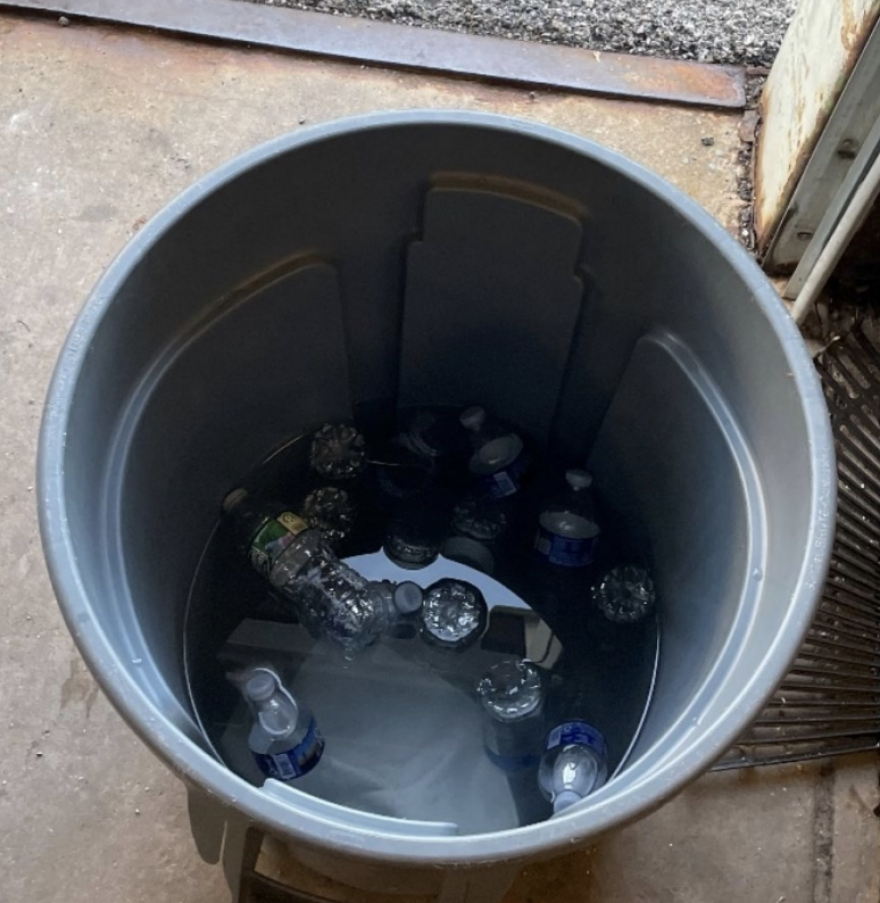 From the report: "During the July 10th site visit, the OIG did not find evidence that any ice or water bottles were delivered to the yard for the early shift employees. Employees reported that water bottles were delivered to the yard
in a trash can full of ice the day before on July 9th. The OIG observed the trash can with no plastic lining
during the site visit where the ice was melted and the water bottles were warm." Photo courtesy of the Baltimore City Office of the Inspector General.