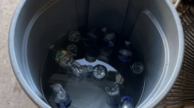 From the report: "During the July 10th site visit, the OIG did not find evidence that any ice or water bottles were delivered to the yard for the early shift employees. Employees reported that water bottles were delivered to the yard
in a trash can full of ice the day before on July 9th. The OIG observed the trash can with no plastic lining
during the site visit where the ice was melted and the water bottles were warm." Photo courtesy of the Baltimore City Office of the Inspector General.