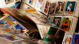 Collection of baseball cards in binders.