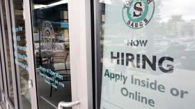 FILE - In this Nov. 4, 2019, file photo a job posting is displayed near the entrance outside a restaurant in Orlando, Fla. Two reports last week show that small business hiring still lags behind the strong job growth reported at larger companies, and that owners are unlikely to increase their staffs significantly in 2020. (AP Photo/John Raoux, File)