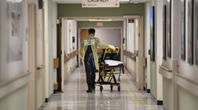 A Prince George County firefighter walks the halls of UM Laurel Medical Center in Laurel, Maryland.