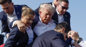 Former President Donald Trump is rushed offstage by U.S. Secret Service agents after being grazed by a bullet during a rally on July 13, 2024 in Butler, Penn.