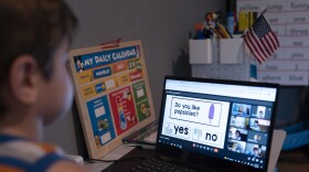 Logan Strauss, 5, participates in an online class from home in Basking Ridge, N.J., Wednesday, July 28, 2021. Logan's parents are keeping him out of school until he gets the COVID-19 vaccine. (AP Photo/Mark Lennihan)