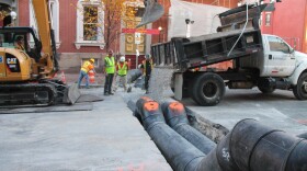 A photo from 2016 of temporary sewer and water pipes on North Charles at Madison Street in Baltimore, Maryland.