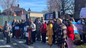 Supporters of trans health bills speak in front of MD Statehouse on Feb. 14.