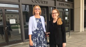 Andrea Barr, left, stands with her attorney Kathleen Cahill outside the Baltimore County Circuit Court.