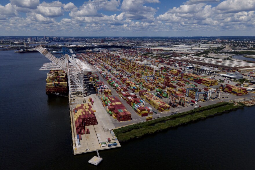 Shipping containers are stacked together at the Port of Baltimore, Friday, Aug. 12, 2022, in Baltimore. During the summer, a massive container ship pulled into port loaded with sheets of plywood, aluminum rods and radioactive material – all sourced from the fields, forests and factories of Russia. (AP Photo/Julio Cortez)