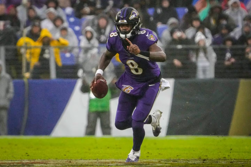 Baltimore Ravens quarterback Lamar Jackson (8) runs down the field during the third quarter against the Los Angeles Rams at M&T Bank Stadium on Sunday, Dec. 10, 2023. (Kylie Cooper/The Baltimore Banner)