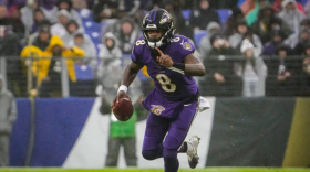 Baltimore Ravens quarterback Lamar Jackson (8) runs down the field during the third quarter against the Los Angeles Rams at M&T Bank Stadium on Sunday, Dec. 10, 2023. (Kylie Cooper/The Baltimore Banner)