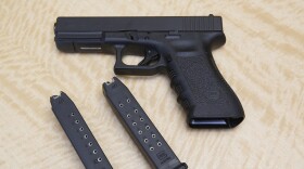 FILE - In this June 27, 2017, file photo, a semi-automatic hand gun is displayed with a 10 shot magazine, left, and a 15 shot magazine, right, at a gun store in Elk Grove, Calif. California would be the first state to require gun owners to buy liability insurance to cover the negligent or accidental use of their firearms, if lawmakers approve a measure announced Thursday, June 16, 2022. (AP Photo/Rich Pedroncelli, File)