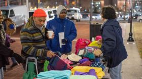 Attendees at Baltimore’s annual Homeless Persons' Memorial Day service sort through items provided for guests to take with them when they leave in December 2022. (Philip Muriel for the Baltimore Banner)