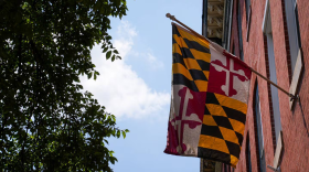 A Maryland flag hangs from a home in Upper Fells Point. (Ulysses Muñoz/The Baltimore Banner)