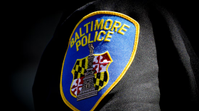 A Baltimore Police patch on an officer's uniform. Photo by Ulysses Muñoz/The Baltimore Banner