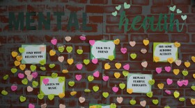 Notes from students expressing support and sharing coping strategies paper a wall, as members of the Miami Arts Studio mental health club raise awareness on World Mental Health Day, Tuesday, Oct. 10, 2023, at Miami Arts Studio, a public 6th-12th grade magnet school, in Miami. (AP Photo/Rebecca Blackwell)