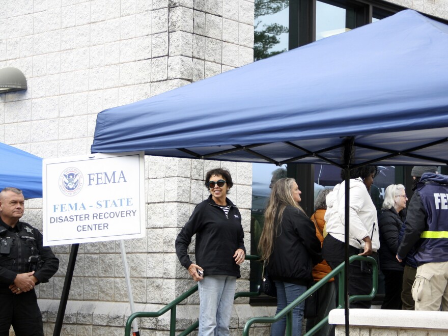 People gather at a FEMA Disaster Recovery Center at A.C. Reynolds High School in Asheville, N.C.,, Tuesday, Oct. 15, 2024.