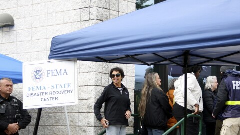 People gather at a FEMA Disaster Recovery Center at A.C. Reynolds High School in Asheville, N.C.,, Tuesday, Oct. 15, 2024.