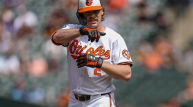 Baltimore Orioles' Gunnar Henderson celebrates after hitting a single during the first inning of a baseball game against the San Francisco Giants, Thursday, Sept. 19, 2024, in Baltimore. (AP Photo/Stephanie Scarbrough)